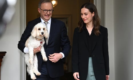 Prime minister, Anthony Albanese (with dog Toto) greets the prime minister of Finland, Sanna Marin, during a visit to Kirribilli House in Sydney today.