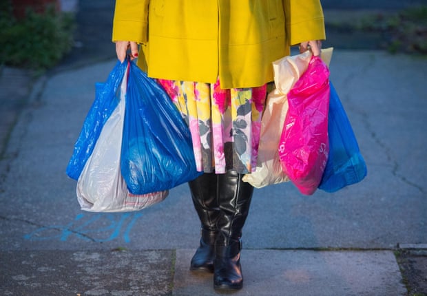 Someone carrying plastic bags