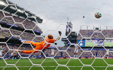 France's Kylian Mbappe scores their first goal.