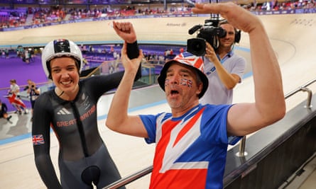 Lizzie and Trevor Jordan celebrate her victory inside the velodrome.
