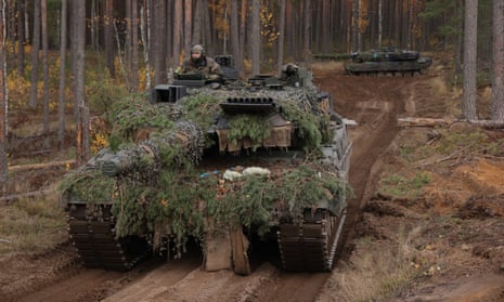 Leopard 2A6 battle tanks participate in military exercises.