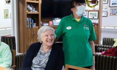 Pam in the dining area of her house with support worker Wendy Morgan 