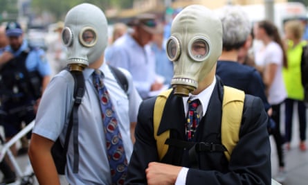 Student activists wear gas masks during the strike in Sydney.