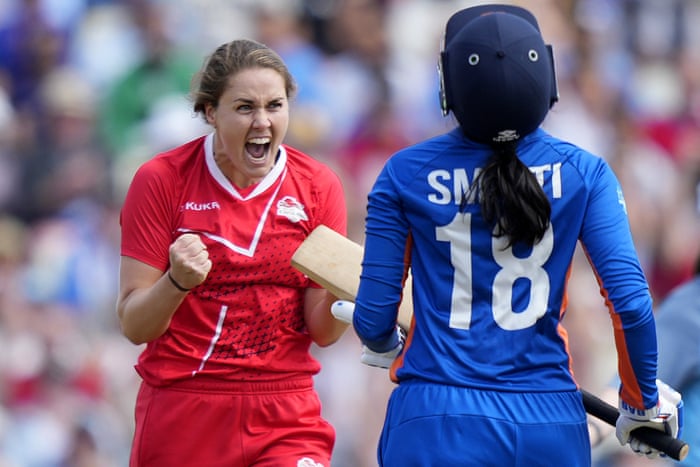 England’s captain Nat Sciver (left) celebrates the dismissal of India’s Smriti Mandhana.