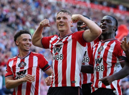 Sunderland’s Dan Ballard is mobbed by his teammates after scoring the second goal against West Ham.