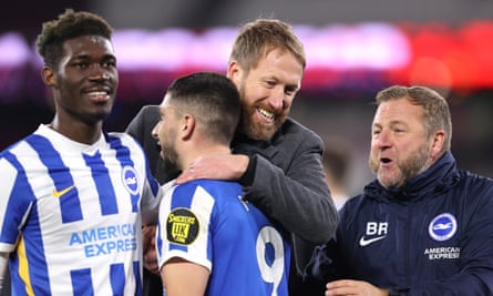 Graham Potter embraces Neal Maupay after the striker’s late goal earned a draw for Brighton at West Ham.