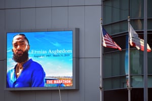 A sign outside the Staples Center bears the image of Nipsey Hussle, whose real name was Ermias Asghedom.