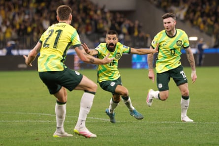 Aziz Behich wheels away after scoring.