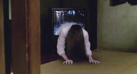 In Ringu, a long-haired ghostly figure crawls out of a television screen onto the floor