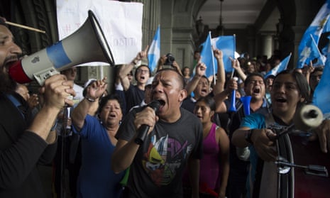 Demonstrators shout slogans against Guatemala’s President Jimmy Morales at the National Palace of Culture in Guatemala City. 