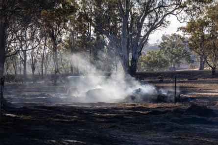 Hay bales burn in a paddock