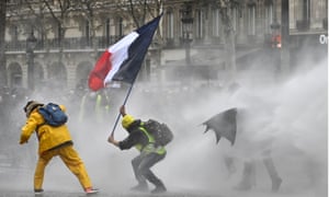 Riot police use water cannon to disperse ‘yellow vests’ on Avenue des Champs-Élysées in Paris on the 17th consecutive Saturday national protest.