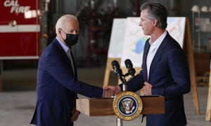 Joe Biden shakes hands with Gavin Newsom before speaking about recent wildfires.