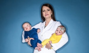 Shannon Clark holding her to babies