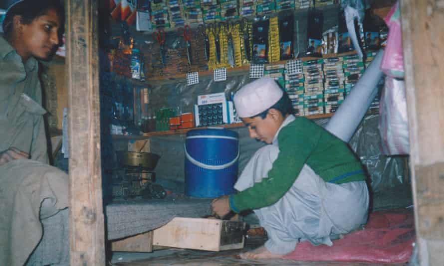 The author, aged eight, sells tailoring supplies at a bazaar.