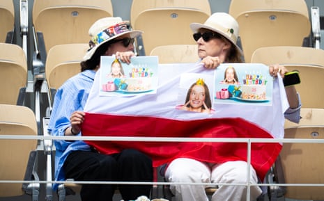 Fans cheer on Iga Swiatek of Poland with a banner celebrating her birthday