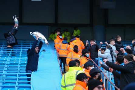 Chelsea fans torment Manchester City with inflatable Champions League trophies at the Etihad Stadium. City had won the game 1-0.