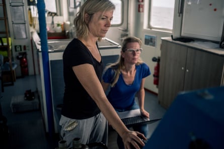 Second mate Helena De Carlos Watts and investigator Sophie Cooke watch the radar screen as the Arctic Sunrise approaches a vessel in the southern Atlantic Ocean.