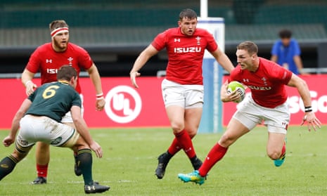 Wales’ George North looks to step past Kwagga Smith