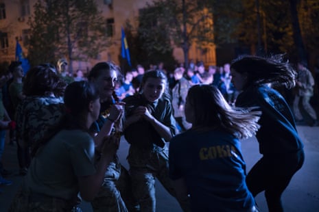 Members of Sokil, the youth wing of the nationalist Svoboda party, dance during a concert in Kiev