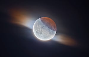 Our moon runner-up: Partial Lunar Eclipse with Clouds by Ethan Roberts (UK) During the 2019 partial lunar eclipse, the photographer managed to capture this fantastic image of the moon while a small cloud passed in front of it. You can see the Earth’s shadow on the top right and its striking orange colour caused by the sun’s light passing through the atmosphere. This is a high dynamic range image, meaning the darker, shadowed region is correctly exposed as well as the much brighter parts of the moon