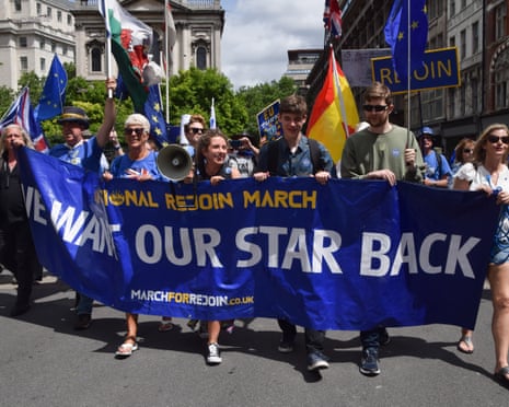 Protesters pass through central London during the National Rejoin March, calling on the UK government to rejoin the European Union on the tenth anniversary of the Brexit referendum.