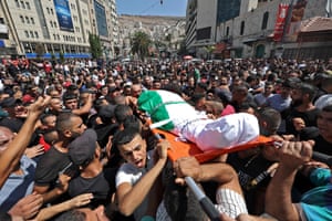 Mourners carry the body of Palestinian, Mohammad Arayshi at his funeral