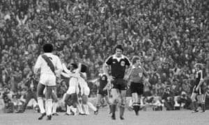 Peru’s Teófilo Cubillas is mobbed by teammates after scoring one of his two goals against Scotland