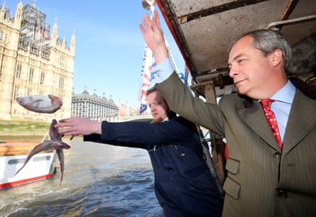 Nigel Farage and the founder of Fishing for Leave, Aaron Brown, symbolically dumping fish next to the Houses of Parliament.