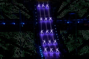 Neon dancers perform.