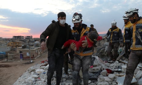 A girl is carried after being rescued in the aftermath of a deadly earthquake in Jandaris, Syria February 10, 2023 in this picture obtained from social media. White Helmets/via REUTERS THIS IMAGE HAS BEEN SUPPLIED BY A THIRD PARTY. MANDATORY CREDIT. NO RESALES. NO ARCHIVES.