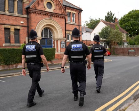 Police officers patrol the Reading Hebrew Congregation in Reading.