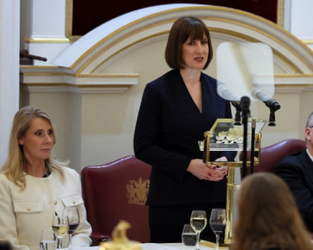 Rachel Reeves delivering her Mansion House speech next to Debbie Crosbie