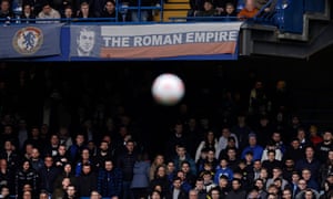 Chelsea fans watch under a banner relating to the ownership of Roman Abramovich during the Premier League match between Chelsea and Newcastle United at Stamford Bridge on March 13th 2022 in London (Photo by Tom Jenkins)