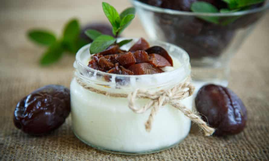 Yoghurt with prunes in a glass jar