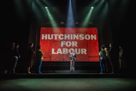 In Our Friends in the North, an actor stands under a spotlight before a large sign that reads 'Hutchinson for Labour'