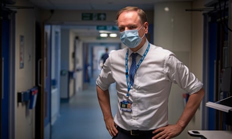 NHS chief, Sir Simon Stevens in a hospital ward
