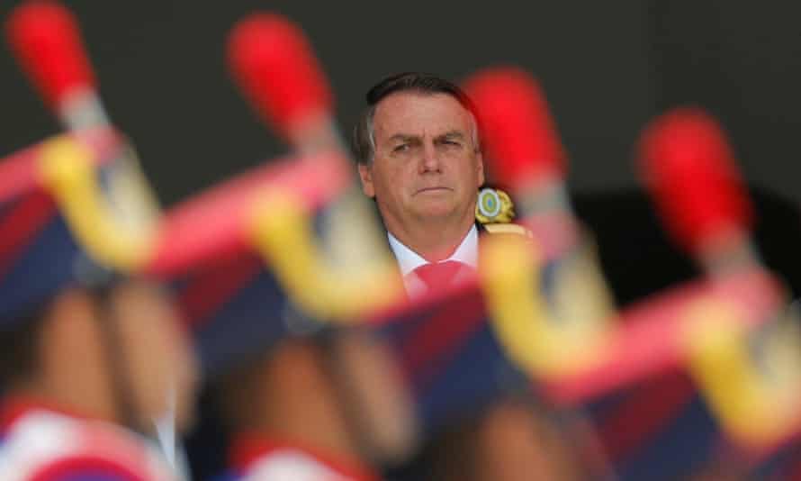 Jair Bolsonaro stands to attention during the change of presidential guard ceremony in Brasilia, Brazil