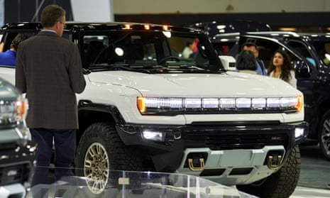 A person looks at the GM Hummer EV at the North American International Auto Show in Detroit, Michigan on September 14, 2022. (Photo by Geoff Robins / AFP) (Photo by GEOFF ROBINS/AFP via Getty Images)