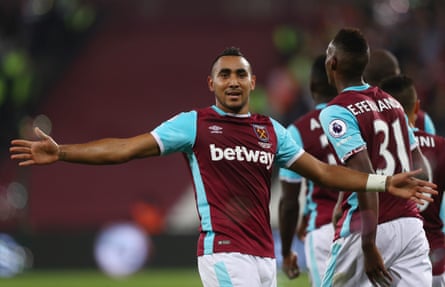 Dimitri Payet celebrates with arms outstretched