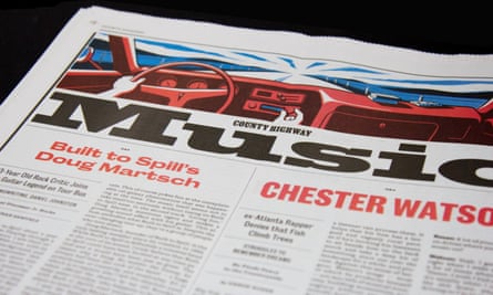 A newspaper page with red and blue sport colours, bearing a large titlepiece saying ‘Music’ and a graphic of a car dashboard with the driver’s hand adjusting the radio dial