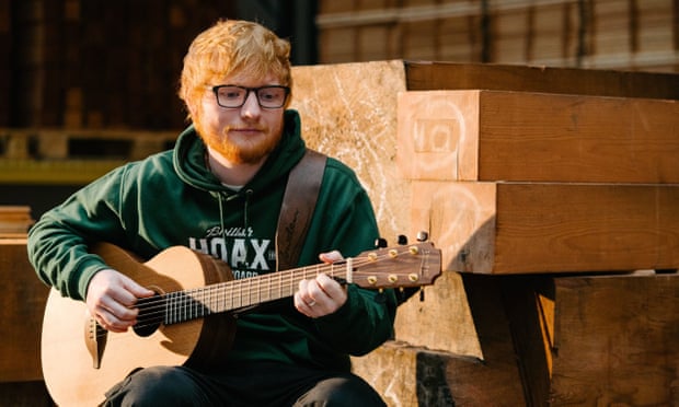 Ed Sheeran with a guitar, name unknown.