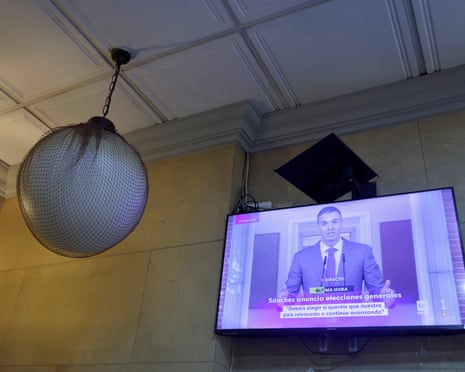 Spain's prime minister Pedro Sánchez is seen on a screen during a live news broadcast, at a coffee shop in Ronda, Spain.