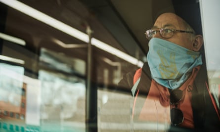 A Sioux Area Metro bus driver wears a protective mask while working in Sioux Falls, South Dakota on 15 April 2020.