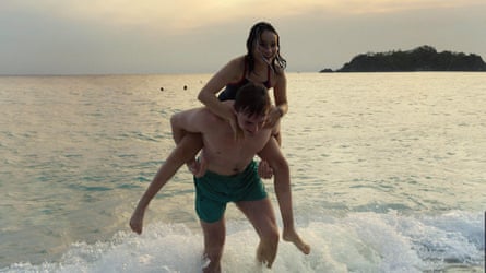 Paul Mescal giving Frankie Corio a piggyback as they paddle in the sea in Aftersun