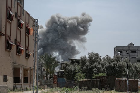 Smoke billows after an Israeli strike on a building in al-Bureij camp in the central Gaza Strip on 22 April.