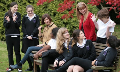 Limpsfield Grange schoolgirls with their headteacher Sarah Wild (in red) and Vicky Martin, their creative writing teacher. 