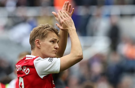Martin Ødegaard applauds the fans