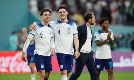 Jack Grealish and Declan Rice celebrate England’s 6-2 rout of Iran while Gareth Southgate walks behind towards Raheem Sterling.