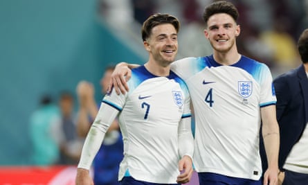 Jack Grealish and Declan Rice celebrate after the 2022 World Cup match between England and Iran at the Khalifa International Stadium